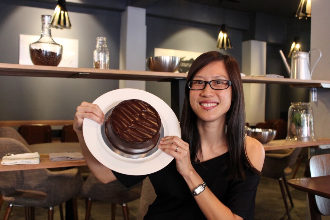 Founder of Awfully Chocolate, Lyn Lee, with the original All Chocolate cake